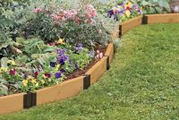 Пластиковый бордюр с рисунком под натуральное дерево Пластиковый бордюр с рисунком под натуральное дерево