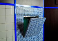 Крышка люка может быть облицована керамической плиткой, мозаикой или другими материалами Крышка люка может быть облицована керамической плиткой, мозаикой или другими материалами