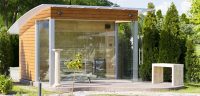 Пример компактной бани для частного дома с панорамными окнами Пример компактной бани для частного дома с панорамными окнами