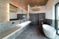 Белая акриловая ванна гармонично смотрится в современно оформленном интерьере ванной комнаты Белая акриловая ванна гармонично смотрится в современно оформленном интерьере ванной комнаты